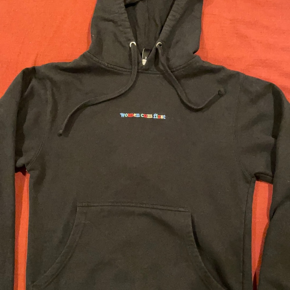 Black “women cum first” hoodie. Size XS.